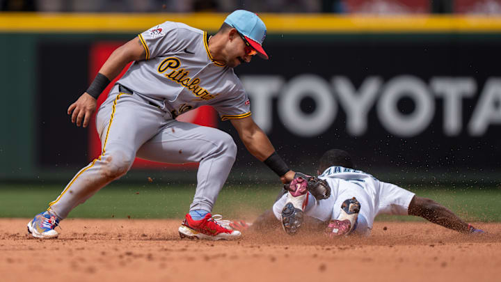 Jul 4, 2025; Seattle, Washington, USA; Pittsburgh Pirates second baseman Nick Gonzales (39) tags out Seattle Mariners left fielder Randy Arozarena (56) attempting to steal second base during the sixth inning at T-Mobile Park. Mandatory Credit: Stephen Brashear-Imagn Images