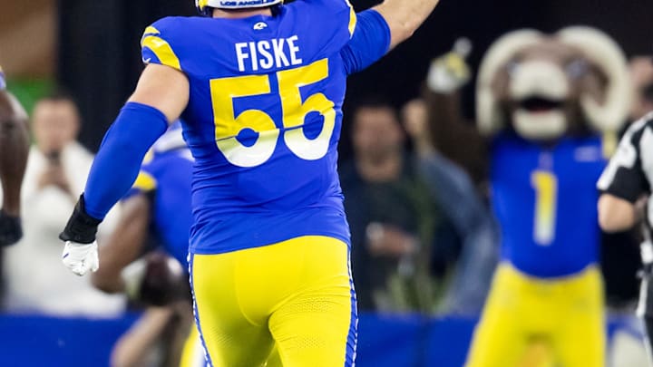 Jan 13, 2025; Glendale, AZ, USA; Los Angeles Rams defensive tackle Braden Fiske (55) celebrates a touchdown  against the Minnesota Vikings during an NFC wild card game at State Farm Stadium. Mandatory Credit: Mark J. Rebilas-Imagn Images