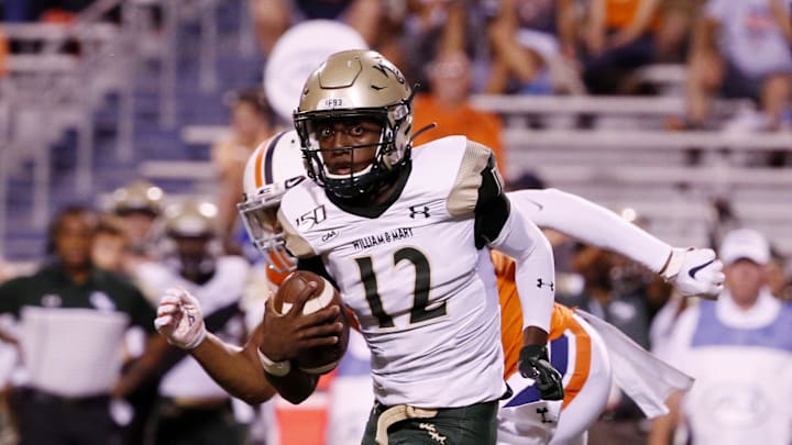 Sep 6, 2019; Charlottesville, VA, USA; William & Mary Tribe quarterback Hollis Mathis (12) runs with the ball against the Virginia Cavaliers during the first quarter at Scott Stadium. Mandatory Credit: Amber Searls-Imagn Images