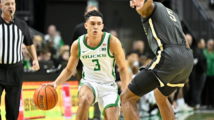 Oregon Ducks guard Jackson Shelstad (3) dribbles the ball against Purdue Boilermakers guard Myles Colvin (5) during the first half at Matthew Knight Arena.