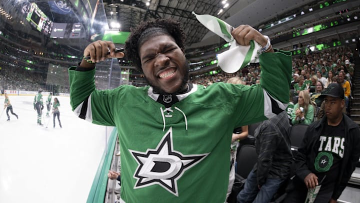 Dallas Cowboys 2025 first round pick Tyler Booker poses for a photo during the first period between the Dallas Stars and the Winnipeg Jets.