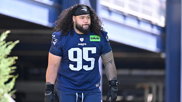 Jul 23, 2025; Foxborough, MA, USA; New England Patriots defensive tackle Khyiris Tonga (95)  walks to the practice field for training camp at Gillette Stadium. Mandatory Credit: Eric Canha-Imagn Images