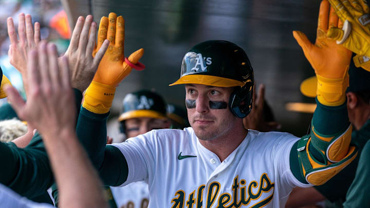 Apr 5, 2026; West Sacramento, California, USA; Athletics right fielder Brent Rooker (25) celebrates in the dugout with teammates after hitting a two run home run against the Houston Astros during the seventh inning at Sutter Health Park. Mandatory Credit: Neville E. Guard-Imagn Images