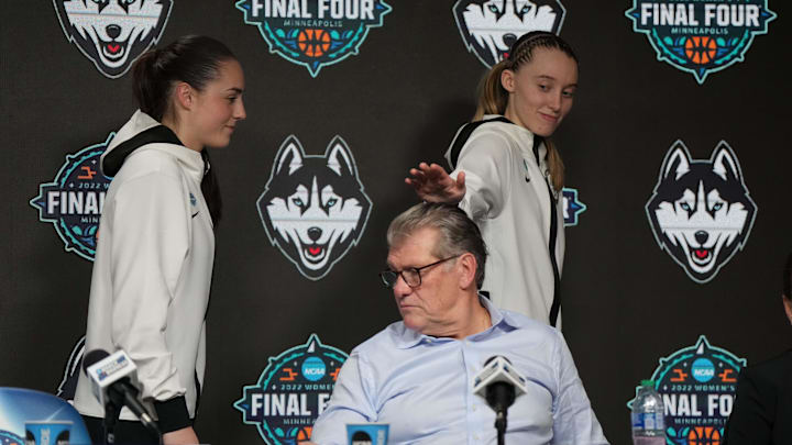 Apr 1, 2022; Minneapolis, MN, USA; UConn Huskies guard Paige Bueckers (5) jokes with UConn Huskies head coach Geno Auriemma (middle) while walking off stage after a media conference after defeating the Stanford Cardinal in the Final Four semifinals of the women's college basketball NCAA Tournament at Target Center. Mandatory Credit: Kirby Lee-Imagn Images Apr 1, 2022; Minneapolis, MN, USA; UConn Huskies guard Paige Bueckers (5) jokes with UConn Huskies head coach Geno Auriemma (middle) while walking off stage after a media conference after defeating the Stanford Cardinal in the Final Four semifinals of the women's college basketball NCAA Tournament at Target Center. Mandatory Credit: Kirby Lee-Imagn Images