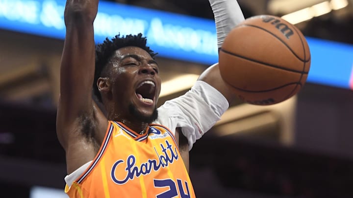 Dec 18, 2025; Charlotte, North Carolina, USA;  Charlotte Hornets forward Brandon Miller (24) dunks during the second half against the Atlanta Hawks at the Spectrum Center. Mandatory Credit: Sam Sharpe-Imagn Images