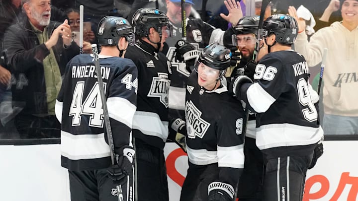Apr 21, 2025; Los Angeles, California, USA; LA Kings right wing Adrian Kempe (9) celebrates with defenseman Mikey Anderson (44), center Anze Kopitar (11), defenseman Drew Doughty (8) and left wing Andrei Kuzmenko (96) after scoring a goal against the Edmonton Oilers in the second period of game one of the first round of the 2025 Stanley Cup Playoffs at Crypto.com Arena. Mandatory Credit: Kirby Lee-Imagn Images