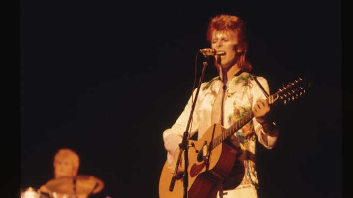 David Bowie on Stage with Acoustic Guitar