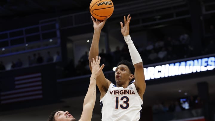 Mar 19, 2024; Dayton, OH, USA; Virginia Cavaliers guard Ryan Dunn (13) shoots the ball over Colorado State Rams forward Joel Scott (1) in the first half at UD Arena. Mandatory Credit: Rick Osentoski-USA TODAY Sports Mar 19, 2024; Dayton, OH, USA; Virginia Cavaliers guard Ryan Dunn (13) shoots the ball over Colorado State Rams forward Joel Scott (1) in the first half at UD Arena. Mandatory Credit: Rick Osentoski-USA TODAY Sports