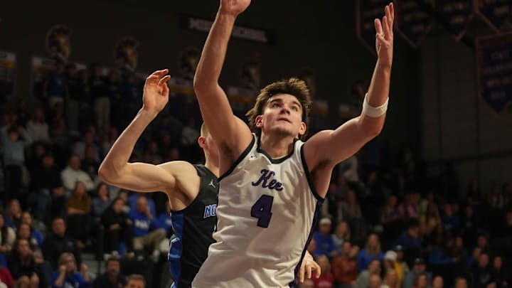 Waukee forward Evan Jacobson reaches for a rebound against Waukee Northwest during a boys basketball game on Dec. 17, 2024, at Waukee High School. Mandatory Credit: Bryon Houlgrave-The Des Moines Register
