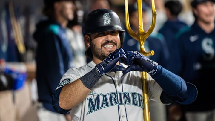 Sep 24, 2025; Seattle, Washington, USA; Seattle Mariners third baseman Eugenio Suarez (28) celebrates in the dugout after hitting a solo home run during the seventh inning against the Colorado Rockies at T-Mobile Park. Mandatory Credit: Stephen Brashear-Imagn Images