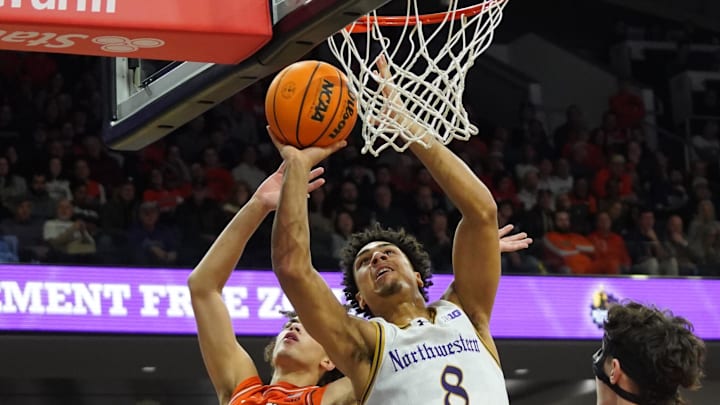 Jan 14, 2026; Evanston, Illinois, USA; Illinois Fighting Illini guard Keaton Wagler (23) defends Northwestern Wildcats forward Tre Singleton (8) during the second half at Welsh-Ryan Arena. Mandatory Credit: David Banks-Imagn Images
