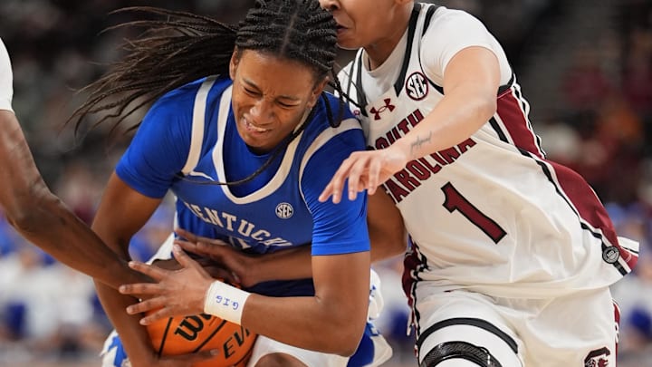 Mar 6, 2026; Greenville, SC, USA; Kentucky Wildcats guard Tonie Morgan (5) goes to the basket against South Carolina Gamecocks guard Maddy McDaniel (1) during the first half at Bon Secours Wellness Arena. Mandatory Credit: Jim Dedmon-Imagn Images