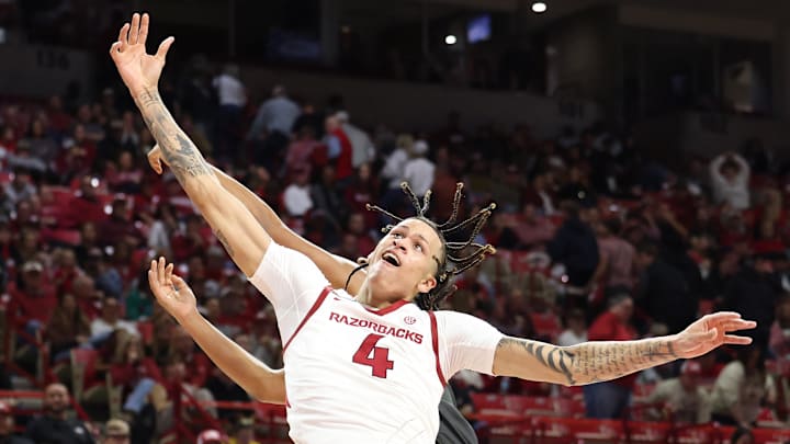 Dec 21, 2024; Fayetteville, Arkansas, USA;  Arkansas Razorbacks forward Trevon Brazile (4) fights for a rebound in the second half against the North Carolina A&T Aggies at Bud Walton Arena. Mandatory Credit: Nelson Chenault-Imagn Images