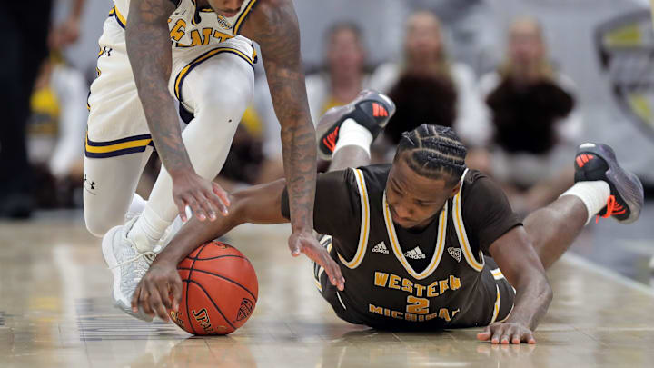 Kent State Golden Flashes guard Cian Medley (11) and Western Michigan Broncos guard Chansey Willis Jr. (2) make a play for a loose ball during the second half of an NCAA college basketball game in the quarterfinals of the Mid-American Conference Tournament at Rocket Arena on Thursday, March 13, 2025, in Cleveland, Ohio. Kent State Golden Flashes guard Cian Medley (11) and Western Michigan Broncos guard Chansey Willis Jr. (2) make a play for a loose ball during the second half of an NCAA college basketball game in the quarterfinals of the Mid-American Conference Tournament at Rocket Arena on Thursday, March 13, 2025, in Cleveland, Ohio.
