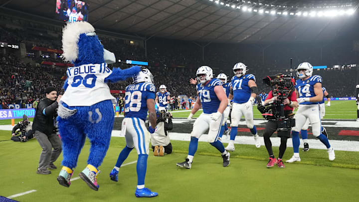 Nov 9, 2025; Berlin, Germany; Indianapolis Colts running back Jonathan Taylor (28) celebrates with teammates and mascot after a touchdown against the Atlanta Falcons during the NFL Berlin Game at Olympic Stadium. 
