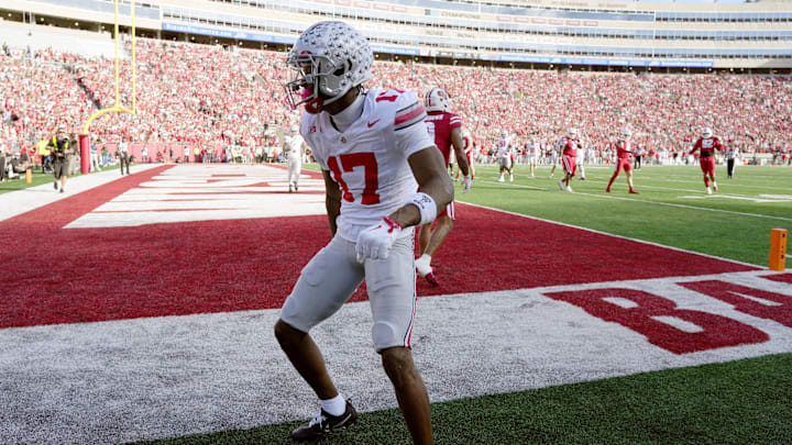 Oct 18, 2025; Madison, Wisconsin, USA; Ohio State Buckeyes wide receiver Carnell Tate (17) celebrates after scoring a touchdown against the Wisconsin Badgers in the first quarter at Camp Randall Stadium. Mandatory Credit: Jeff Hanisch-Imagn Images