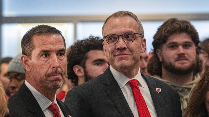 Mcintosh (right) threw his support behind Fickell (left) despite Wisconsin's second straight decisive loss. 