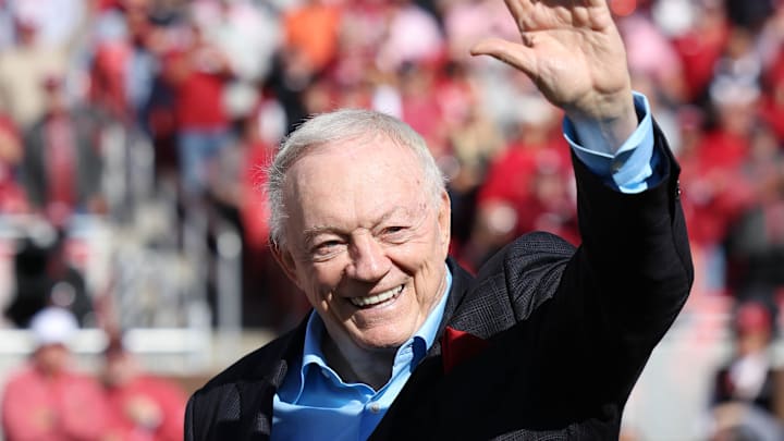 Dallas Cowboys owner and member of the 1964 Arkansas Razorbacks National Championship team, Jerry Jones, waves to the crowd as the team is honored against the Texas Longhorns.
