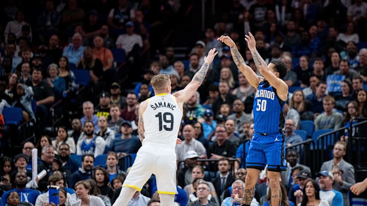 Orlando Magic guard Cole Anthony (50) shoots the three pointer over Utah Jazz forward Luka Samanic (19) at Kia Center.