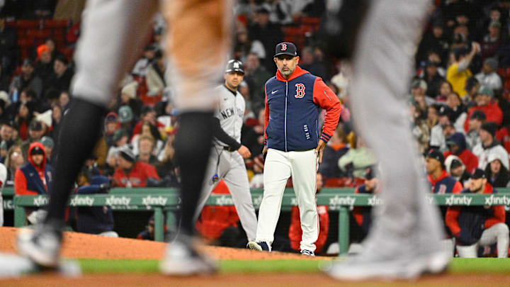 Apr 22, 2026; Boston, Massachusetts, USA; Boston Red Sox manager Alex Cora (13) walks to the pitcher's mound during fifth inning against the New York Yankees at Fenway Park. Mandatory Credit: Eric Canha-Imagn Images