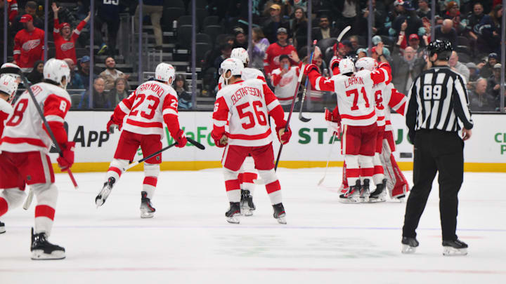 Feb 4, 2025; Seattle, Washington, USA; The Detroit Red Wings celebrate defeating the Seattle Kraken at Climate Pledge Arena. Mandatory Credit: Steven Bisig-Imagn Images