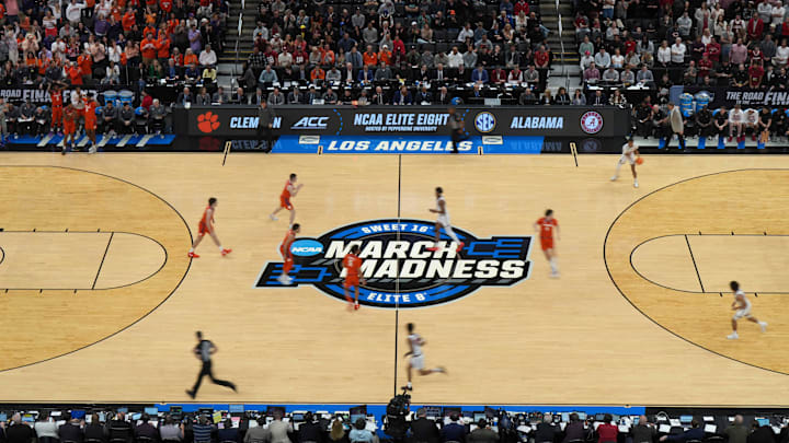 The NCAA March Madness Sweet 16 and Elite Eight logo at midcourt The NCAA March Madness Sweet 16 and Elite Eight logo at midcourt