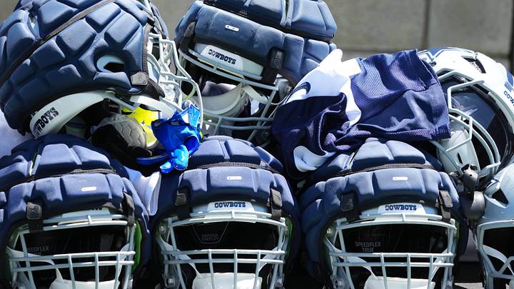 Dallas Cowboys helmets with Guardian helmet caps at training camp at the River Ridge Fields.
