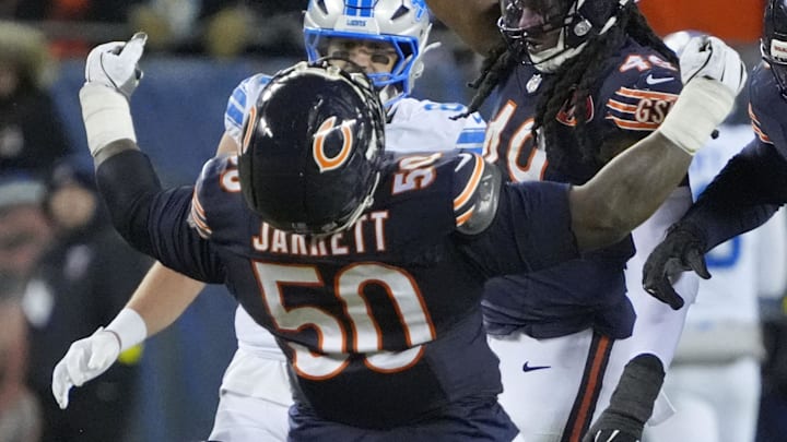 Jan 4, 2026; Chicago, Illinois, USA; Chicago Bears defensive end Grady Jarrett (50) and linebacker Tremaine Edmunds (49) celebrate after a play against the Detroit Lions during the second half at Soldier Field. Mandatory Credit: David Banks-Imagn Images