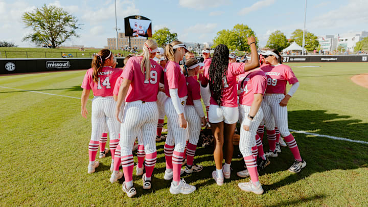 Mizzou softball team huddles in left field before its game on May 1, 2025, against the Georgia Bulldogs.