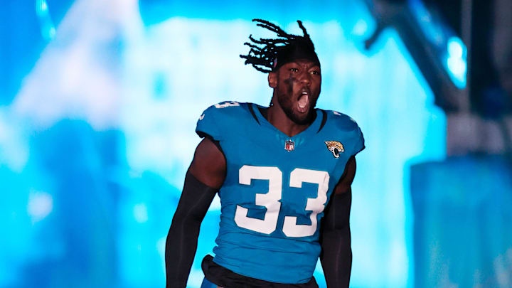 Jaguars linebacker Devin Lloyd (33) is introduced before a regular season NFL football matchup