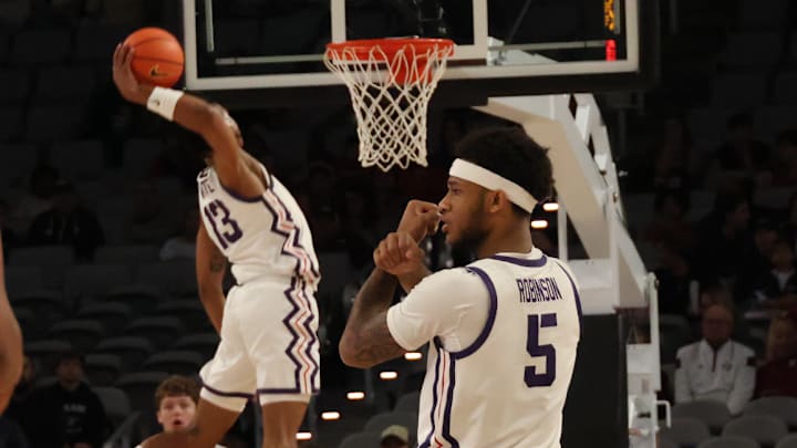 Micah Robinson and Trazarien White complete a dunk in TCU's loss against Vanderbilt on Sunday, December 8, 2024. Micah Robinson and Trazarien White complete a dunk in TCU's loss against Vanderbilt on Sunday, December 8, 2024.
