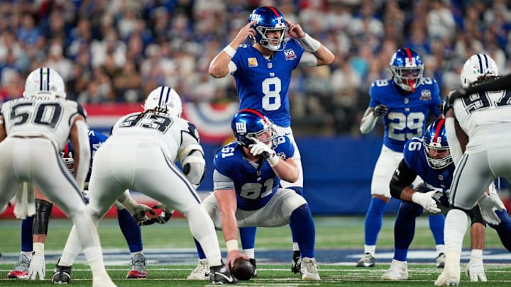 Sep 26, 2024; East Rutherford, NJ, US; New York Giants quarterback Daniel Jones (8) calls a play from behind New York Giants center John Michael Schmitz Jr. (61) at MetLife Stadium. Sep 26, 2024; East Rutherford, NJ, US; New York Giants quarterback Daniel Jones (8) calls a play from behind New York Giants center John Michael Schmitz Jr. (61) at MetLife Stadium.