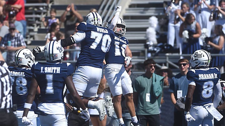 Nevada’s Marcus Bellon (18) and Isaiah World celebrate a touchdown while taking on Eastern Washington during their football game at Mackay Stadium in Reno on Sept. 21, 2024.