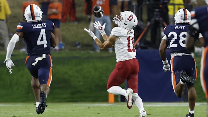 Sep 20, 2025; Charlottesville, Virginia, USA; Stanford Cardinal wide receiver Bryce Farrell (11) catches a touchdown pass as Virginia Cavaliers defensive back Christian Charles (4) and Cavaliers defensive back Donavon Platt (28) chase during the third quarter at Scott Stadium. Mandatory Credit: Geoff Burke-Imagn Images Sep 20, 2025; Charlottesville, Virginia, USA; Stanford Cardinal wide receiver Bryce Farrell (11) catches a touchdown pass as Virginia Cavaliers defensive back Christian Charles (4) and Cavaliers defensive back Donavon Platt (28) chase during the third quarter at Scott Stadium. Mandatory Credit: Geoff Burke-Imagn Images