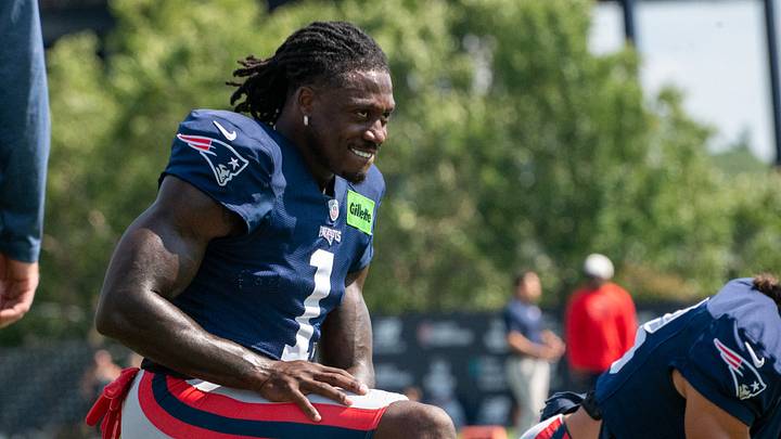 New England Patriots wide receiver A.J. Brown stretches during a joint practice against the Philadelphia Eagles. New England Patriots wide receiver A.J. Brown stretches during a joint practice against the Philadelphia Eagles.