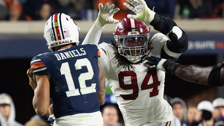 Nov 29, 2025; Auburn, Alabama, USA; Alabama defensive lineman Edric Hill (94) pressures Auburn quarterback Ashton Daniels (12) at Jordan-Hare Stadium. Alabama defeated Auburn 27-20. Mandatory Credit: Gary Cosby Jr.-Tuscaloosa News Nov 29, 2025; Auburn, Alabama, USA; Alabama defensive lineman Edric Hill (94) pressures Auburn quarterback Ashton Daniels (12) at Jordan-Hare Stadium. Alabama defeated Auburn 27-20. Mandatory Credit: Gary Cosby Jr.-Tuscaloosa News