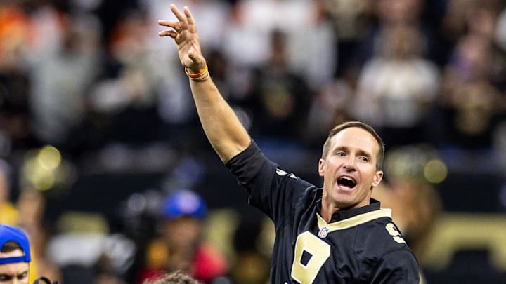 Oct 17, 2024; New Orleans, Louisiana, USA;  Former New Orleans Saints quarterback Drew Brees on the field for the coin toss against the Denver Broncos during the first half at Caesars Superdome. Mandatory Credit: Stephen Lew-Imagn Images