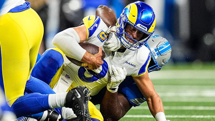 Los Angeles Rams quarterback Matthew Stafford (9) is sacked by Detroit Lions defensive end Levi Onwuzurike (91) during the first half at Ford Field in Detroit on Sunday, September 8, 2024. Los Angeles Rams quarterback Matthew Stafford (9) is sacked by Detroit Lions defensive end Levi Onwuzurike (91) during the first half at Ford Field in Detroit on Sunday, September 8, 2024.