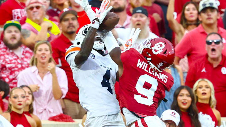 Oklahoma Sooners defensive back Gentry Williams (9) breaks up a pass intended for Auburn Tigers wide receiver Malcolm Simmons (4) during the second half at Gaylord Family-Oklahoma Memorial Stadium. 