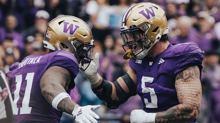 Alphonzo Tuputala and Zach Durfee celebrate a defensive stop. 