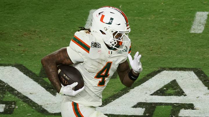 Jan 19, 2026; Miami Gardens, FL, USA; Miami Hurricanes running back Mark Fletcher Jr. (4) carries the ball against the Indiana Hoosiers in the third quarter during the College Football Playoff National Championship game at Hard Rock Stadium. Mandatory Credit: Kim Klement Neitzel-Imagn Images