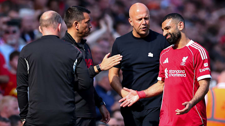 Mohamed Salah (right) limped off injured.