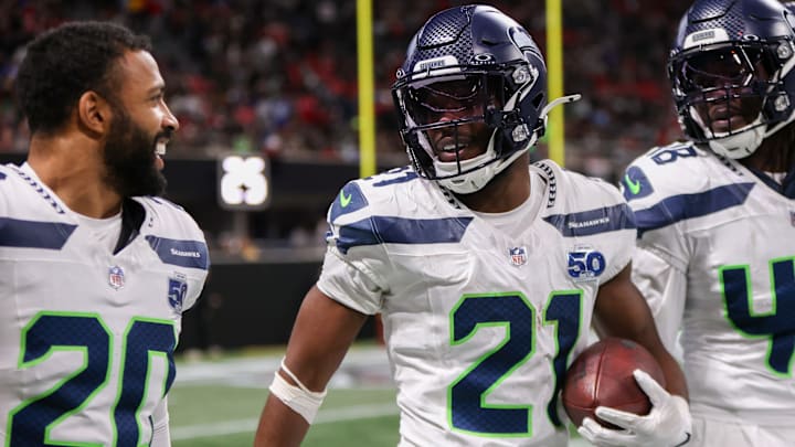Dec 7, 2025; Atlanta, Georgia, USA; Seattle Seahawks cornerback Devon Witherspoon (21) celebrates with safety Julian Love (20) after an interception against the Atlanta Falcons in the fourth quarter at Mercedes-Benz Stadium. Dec 7, 2025; Atlanta, Georgia, USA; Seattle Seahawks cornerback Devon Witherspoon (21) celebrates with safety Julian Love (20) after an interception against the Atlanta Falcons in the fourth quarter at Mercedes-Benz Stadium.