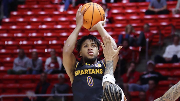 San Jose State Spartans guard Colby Garland (0) shoots over Utah Utes guard Terrence Brown (2) at the Jon M. Huntsman Center. San Jose State Spartans guard Colby Garland (0) shoots over Utah Utes guard Terrence Brown (2) at the Jon M. Huntsman Center.
