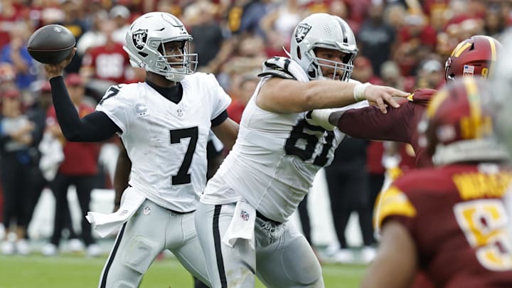Sep 21, 2025; Landover, Maryland, USA; Las Vegas Raiders quarterback Geno Smith (7) passes the ball against the Washington Commanders during the third quarter at Northwest Stadium. Mandatory Credit: Geoff Burke-Imagn Images
