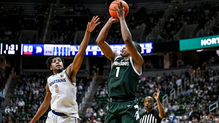 Michigan State's Jeremy Fears Jr., right, makes a 3-pointer as San Jose State's Colby Garland defends during the second half on Thursday, Nov. 13, 2025, at the Breslin Center in East Lansing.