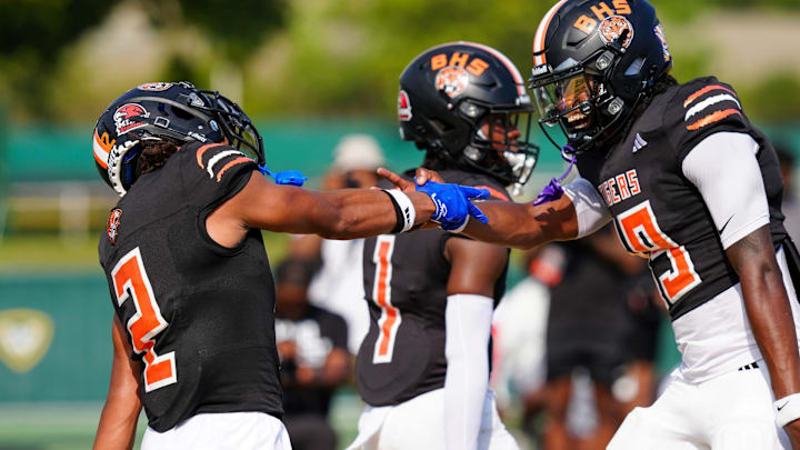 Belleville's Adrian Walker Jr. celebrates with Bryce Underwood after Walker made a touchdown against Clarkston during the 2024 Xenith Prep Kickoff Classic at Wayne State's Tom Adams Field in Detroit on Friday, Aug. 30, 2024.