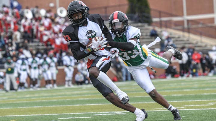 South Carolina receiver Christian Zachary of Calhoun County High, Virginia commit, catches a pass for a touchdown near North Carolina linebacker Tre Mittman III of Southern Durham High, committed to NC AT&T, during the third quarter of the Shrine Bowl of the Carolinas football game at Viking Stadium in Spartanburg, S.C. Saturday, December 16, 2023.