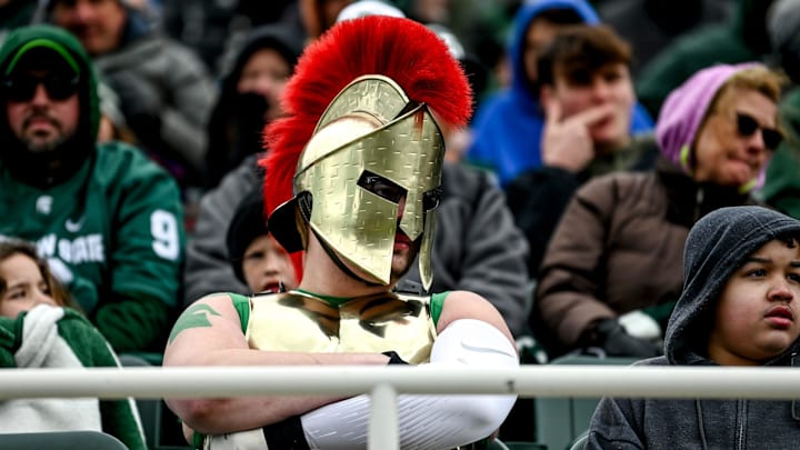 A Michigan State fan dressed as a spartan takes in the action during the Spring Showcase on