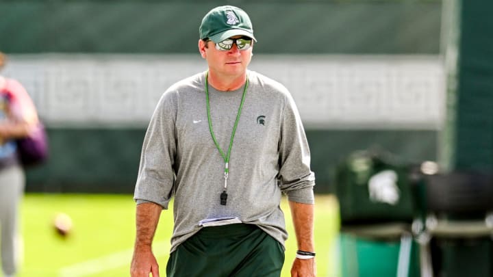 Michigan State's head coach Jonathan Smith looks on during the first day of football camp on Tuesday, July 30, 2024, in East Lansing. Michigan State's head coach Jonathan Smith looks on during the first day of football camp on Tuesday, July 30, 2024, in East Lansing.